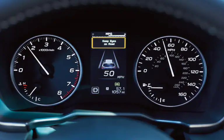 A close-up of a warning message on the dashboard display from the DriverFocus Distraction Mitigation System available on the 2022 Subaru Outback.